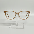 Brown eyeglasses on a clear stand against a white background