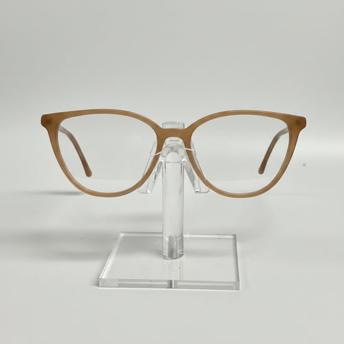 Brown eyeglasses on a clear stand against a white background