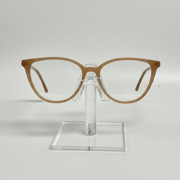 Brown eyeglasses on a clear stand against a white background