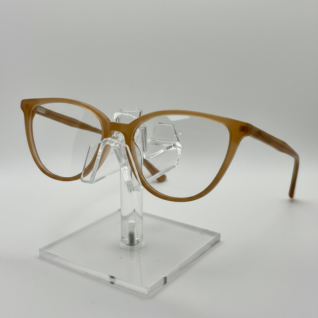 Brown eyeglasses on a clear stand against a white background