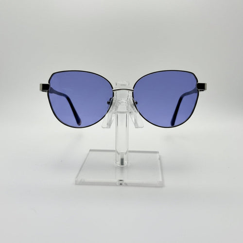 Sunglasses with blue lenses on a clear stand against a white background