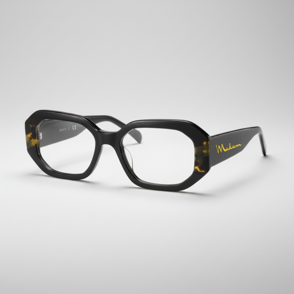 Black eyeglasses with gold accents on a white background