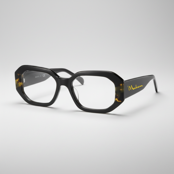 Black eyeglasses with gold accents on a white background
