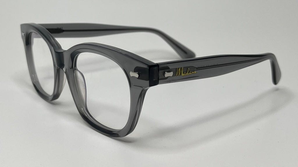 Black eyeglasses on a light gray background