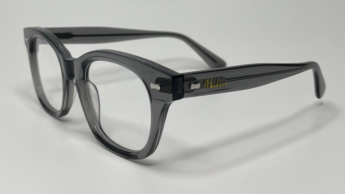 Black eyeglasses on a light gray background
