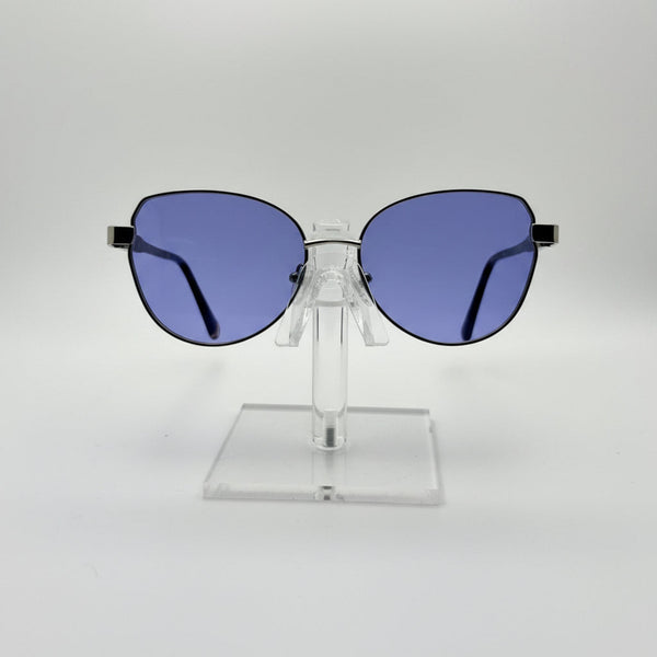 Sunglasses with blue lenses on a clear stand against a white background