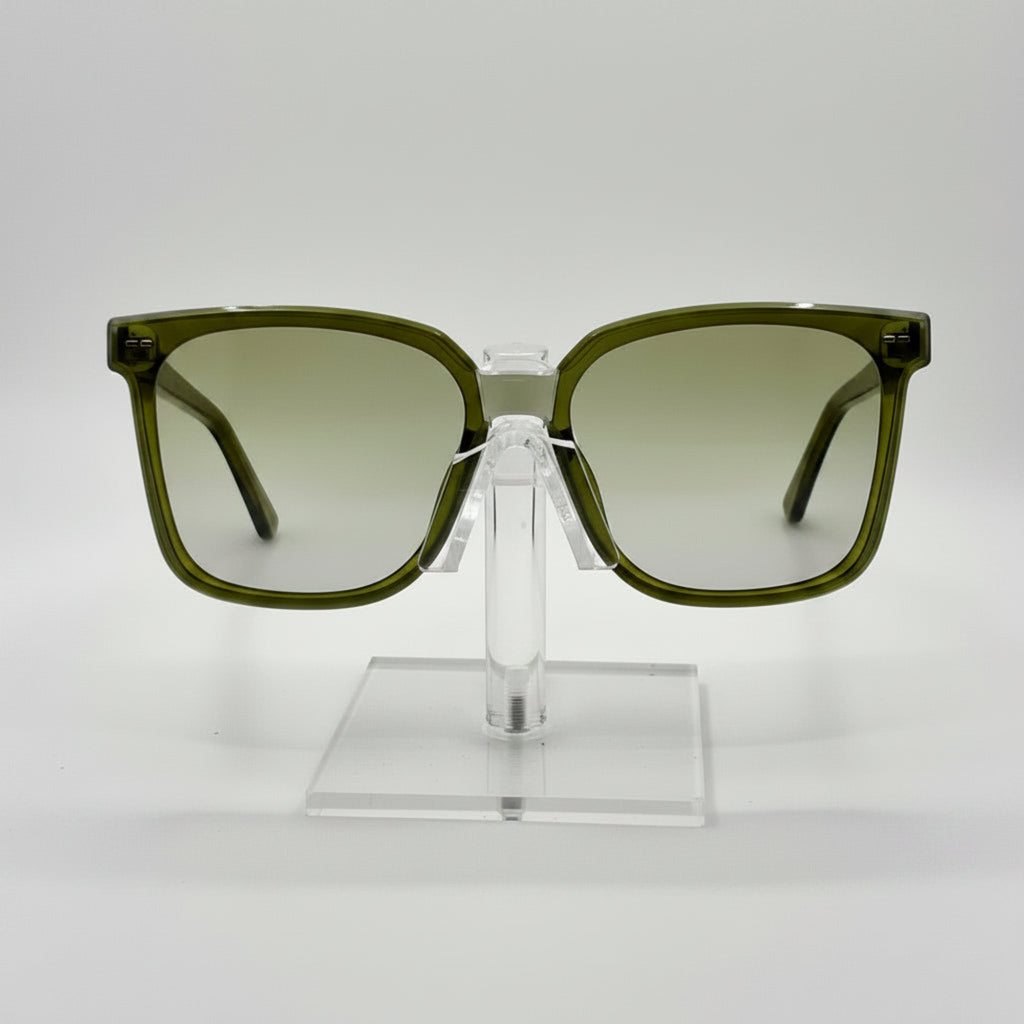 Green sunglasses on a clear stand against a white background